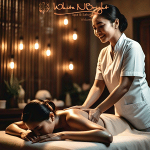 Spa therapist performing a traditional Balinese massage using warm essential oils